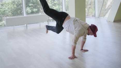 man breakdancing in modern studio