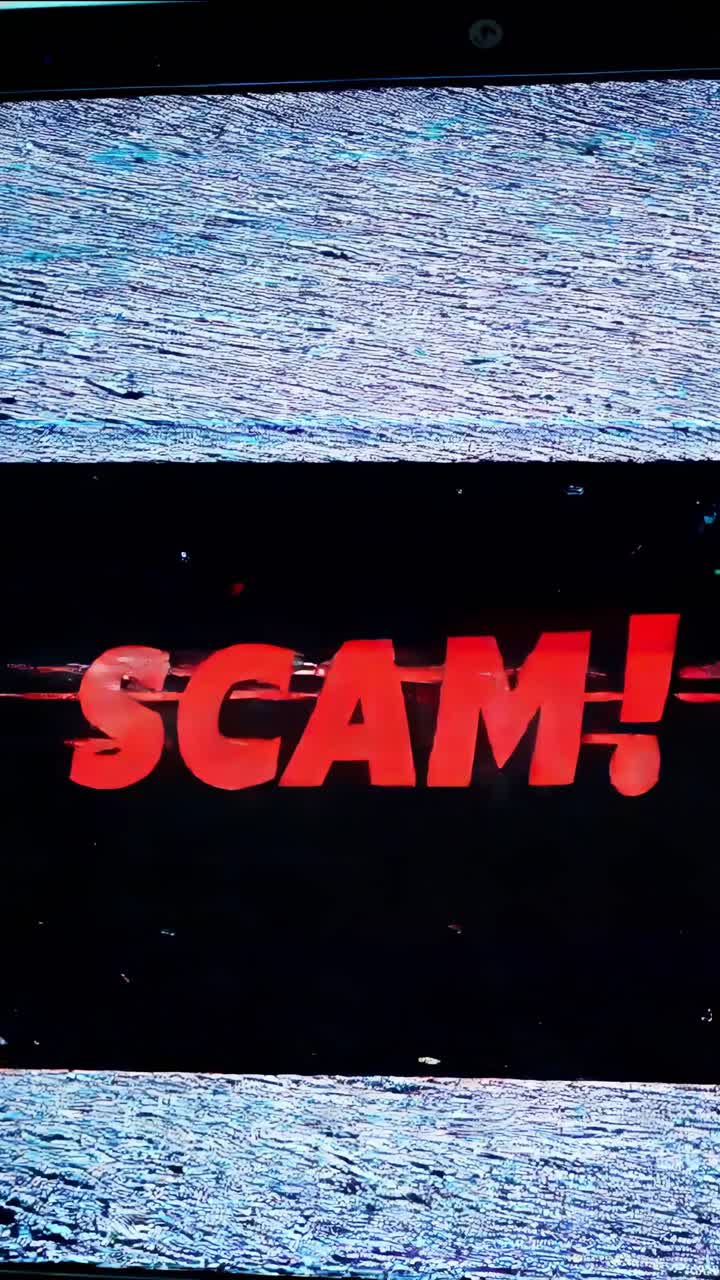 Computer screen displays a prominent SCAM! warning in red, overlaid with a distorted digital noise effect, suggesting a compromised system or a fraudulent activity alert