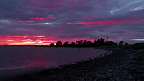 Beautiful-sunset-over-the-sea-in-the-clouds-passing-by-in-timelapse