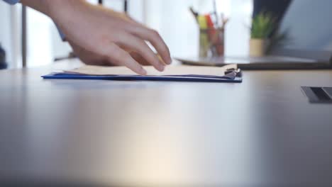 Businessman-gets-angry-at-the-article-he-reads-in-his-office.