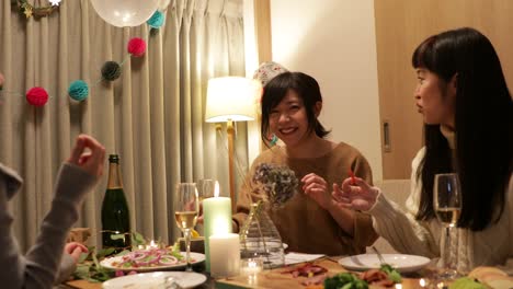 japanese girls enjoying christmas dishes