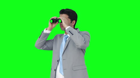 businessman looking through binoculars
