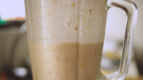 closeup-of-blender-mixing-ingredients-to-make-leche-de-tigre