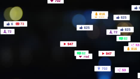 animation of social media icons floating against blurred view of night city traffic