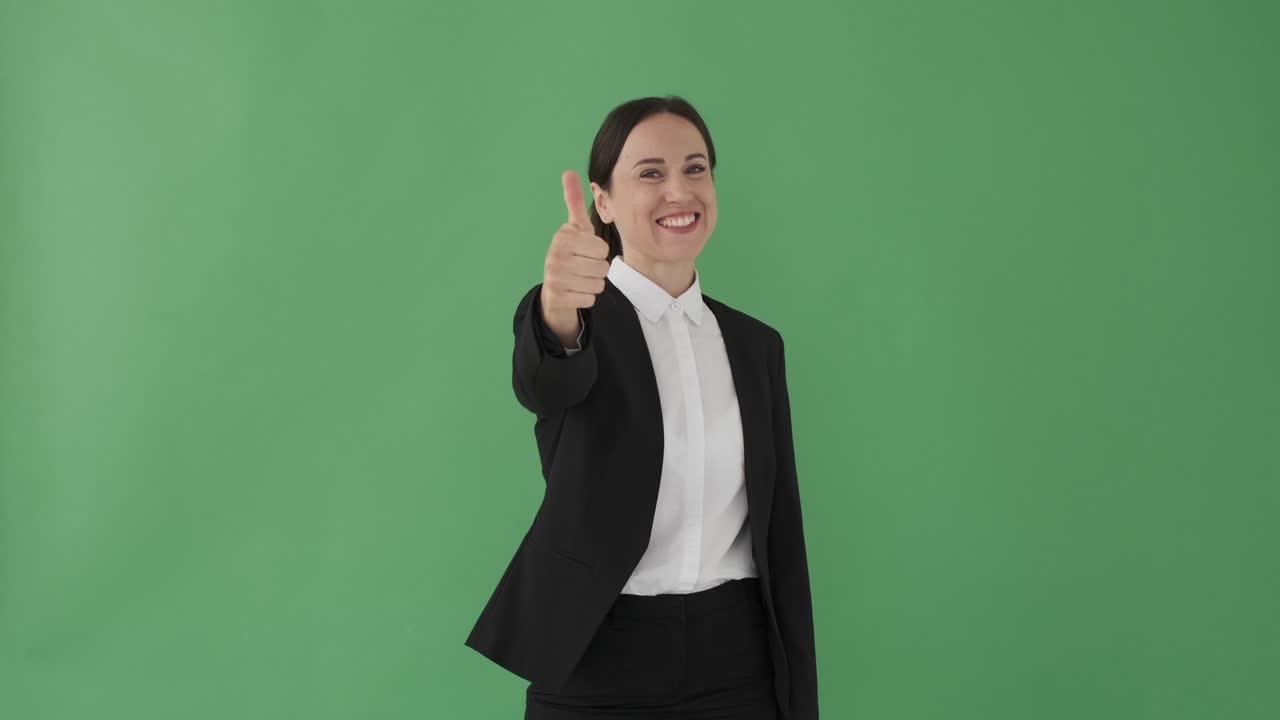 Businesswoman giving thumbs up gesture