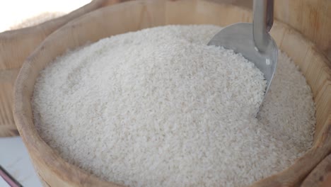 close-up of white rice in a wooden bowl