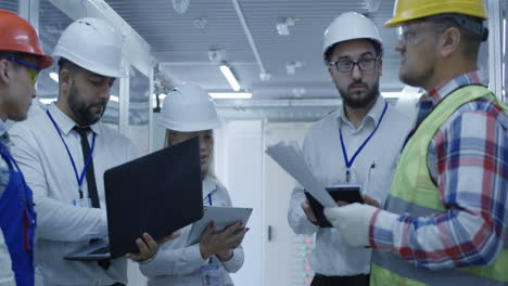 engineering team meeting in server room