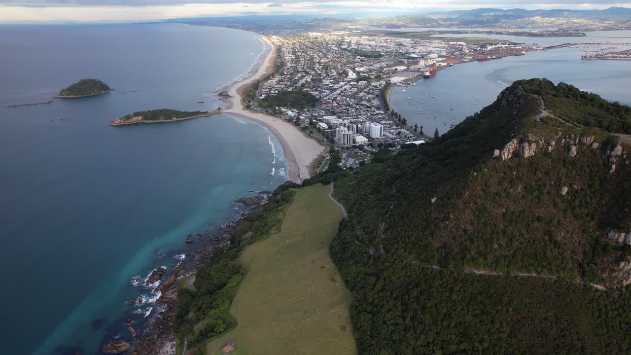 Panoramic Aerial View of a Coastal City, Beach, and Mountain Peninsula