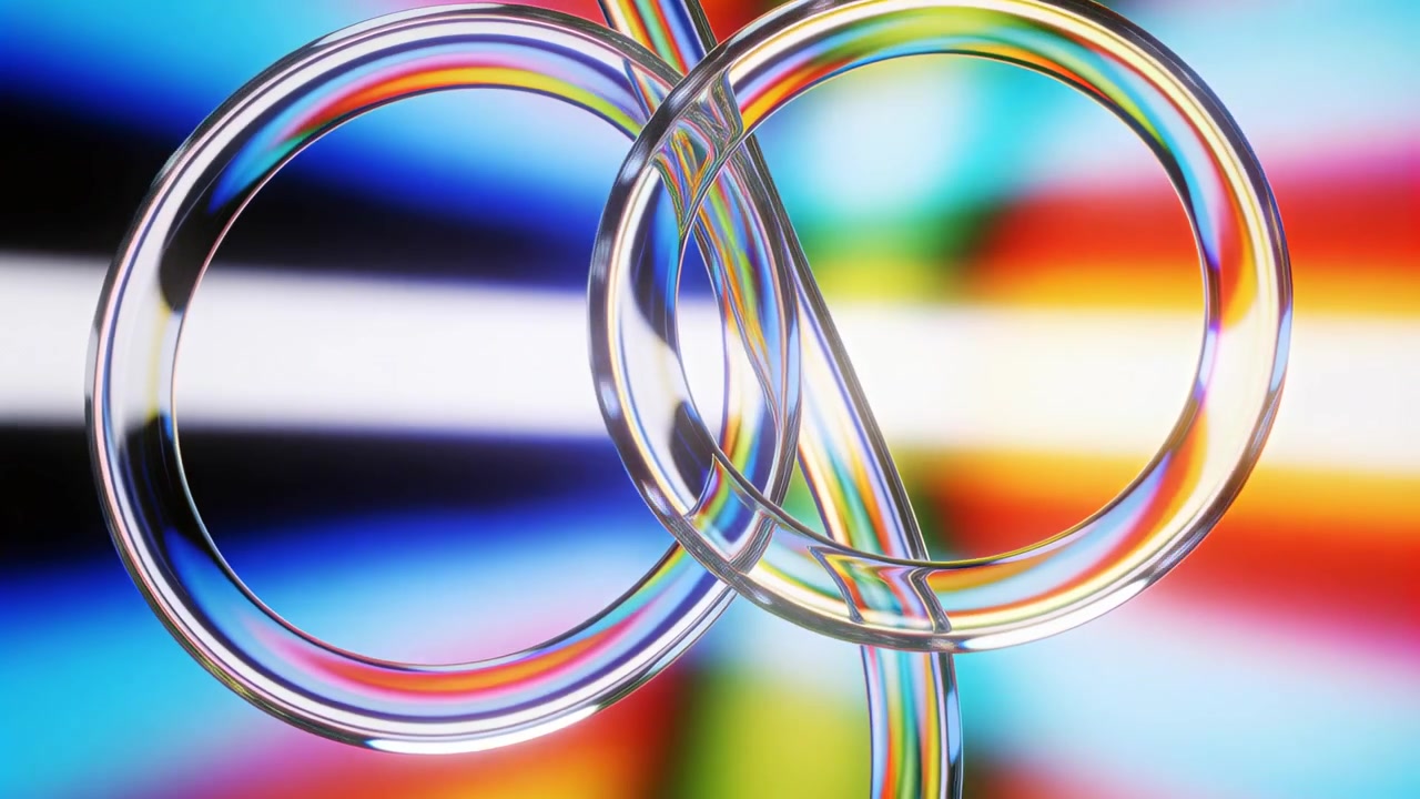 Starting first frame, three transparent hoops rotating and sliding in studio, revealing cut ends