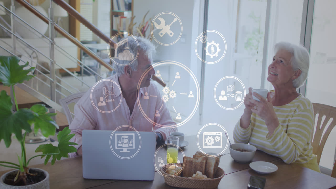 animación de la red de conexiones sobre una pareja caucásica mayor usando una computadora portátil