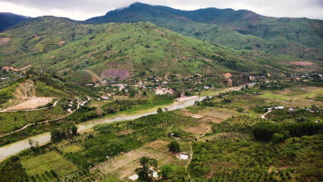 rural village next to river valley in secluded southeast asia