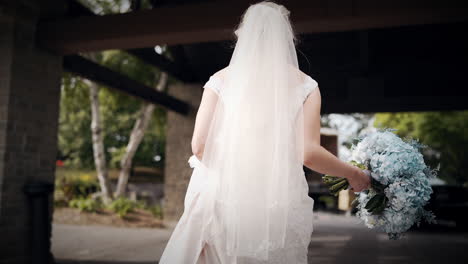 bride walking outside in a beautiful white dress