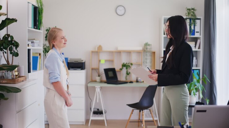 Businesswoman Welcomes Job Candidate for Interview
