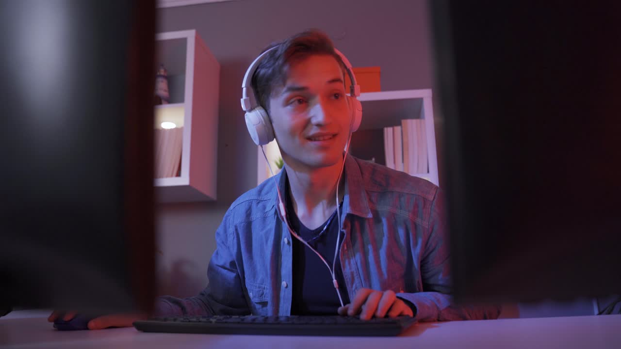Young Man Playing Online Shooter Video Game.