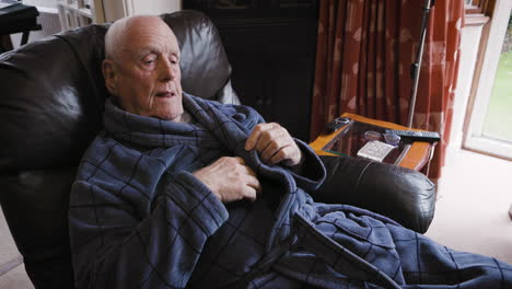 elderly man sleeping in a chair
