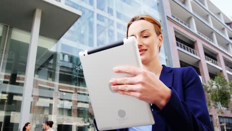 Businesswoman-using-digital-tablet-in-the-office-building