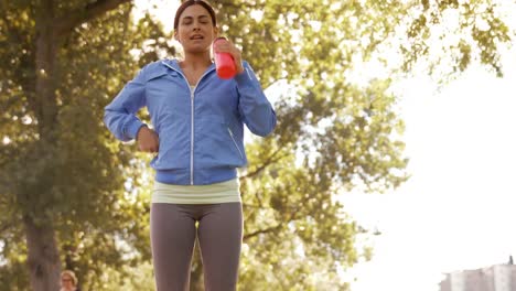 Pretty-brunette-jogging-in-park