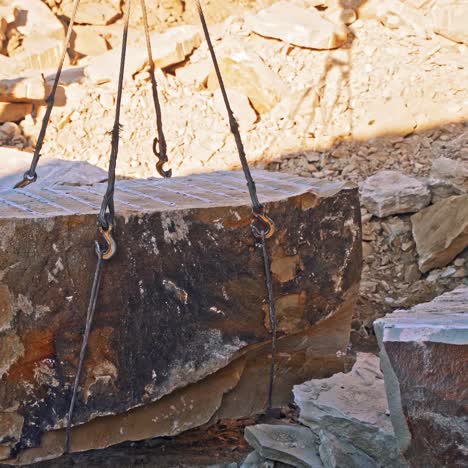 crane lifting heavy rock