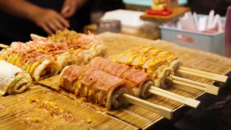 grilled skewers being prepared at a food stall