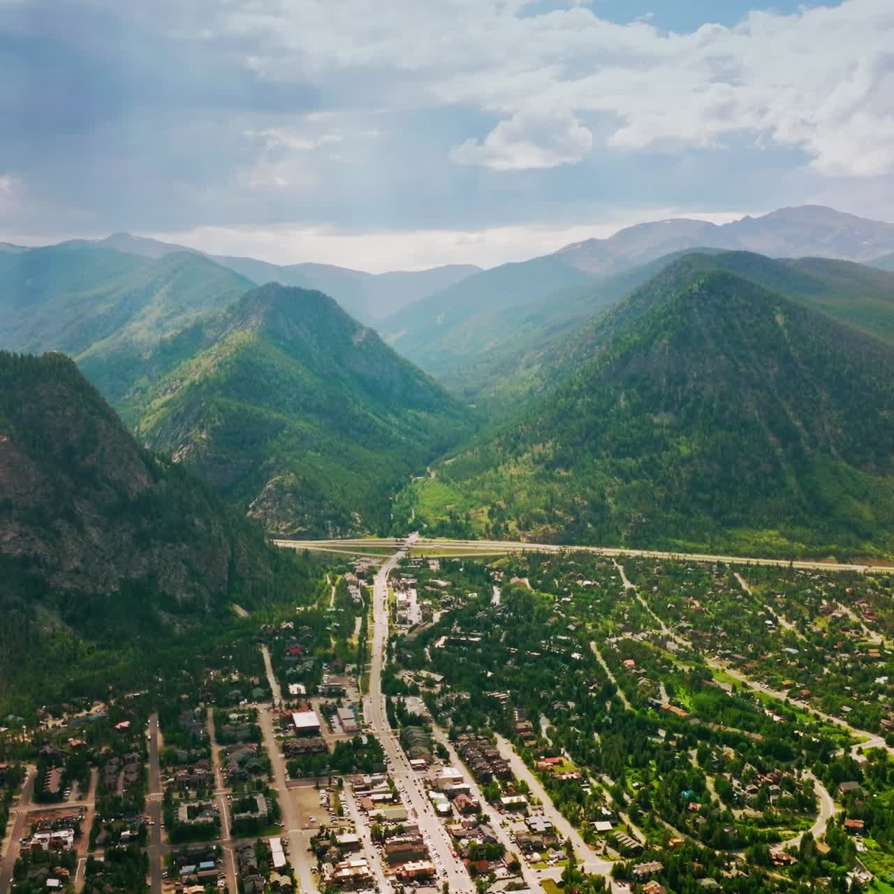 Picturesque resort city located at the foot of amazing mountains. Scenic aerial view of Aspen city in Colorado state, USA