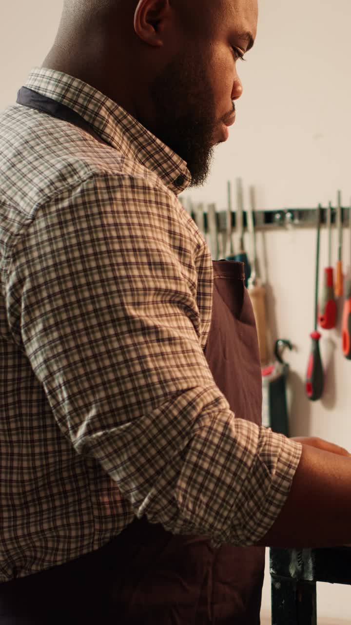 Focused Craftsman Working with Wood in a Workshop