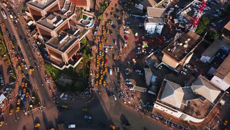 aerial view overlooking yellow taxis and traffic on the streets of yaounde, cameroon