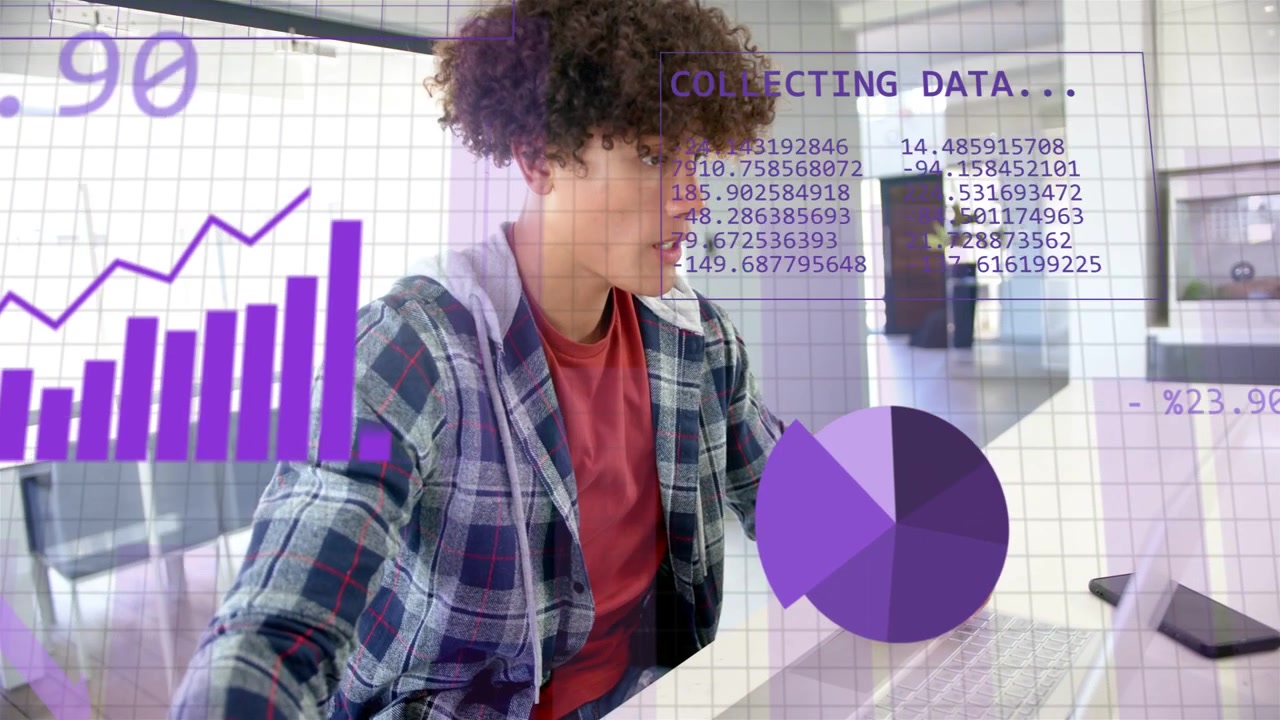 Man at desk reaching for mug, typing on laptop while purple data overlays building for analysing