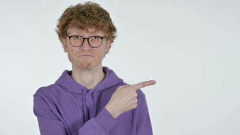 copy space, redhead young man pointing with finger, white background