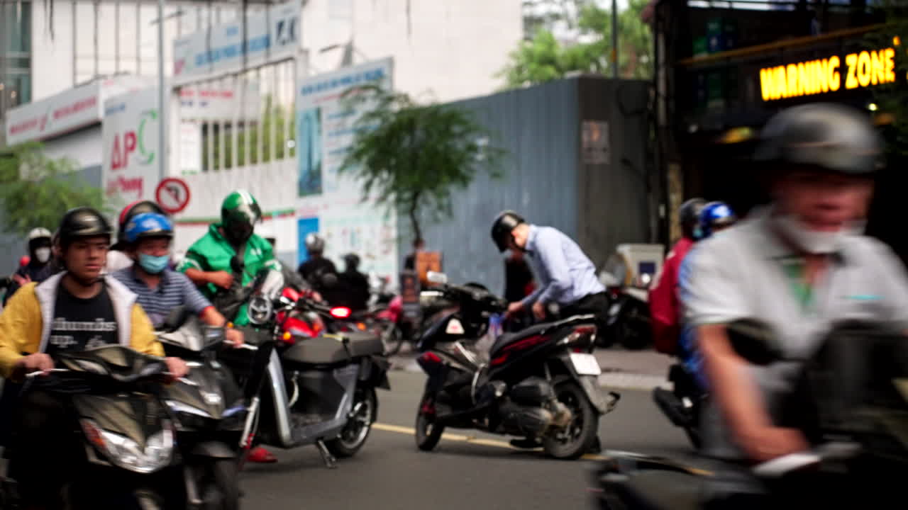 Busy Street Scene in Vietnam with Motorcycles and People