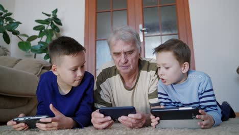 parents relaxing at home. family watching media content on smart phone in the living room at home