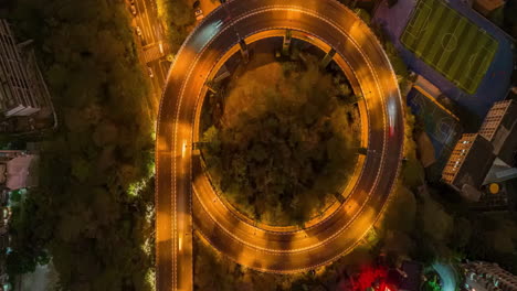 aerial night view of a circular city overpass and sports facilities