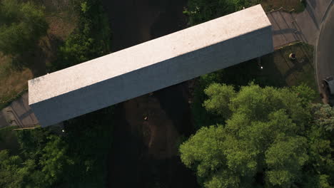 zumbro river with the vintage wooden covered bridge in zumbrota, minnesota, united states