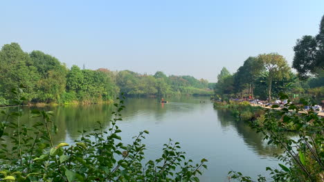 a lake with a fisherman