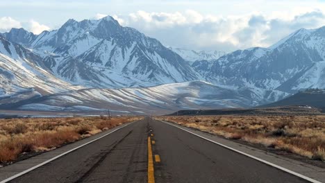 benton crossing road convict canyon lake road natural hot springs sierra nevada mountains snowy dramatic peaks aerial drone california highway road mammoth lakes mountains forward motion