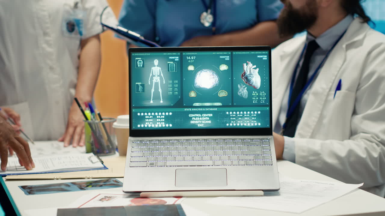 Medical professionals analyzing medical data on a laptop