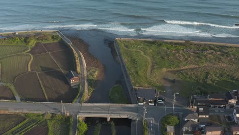 aerial tilt reveal of sea of japan from rural daisen town, tottori prefecture