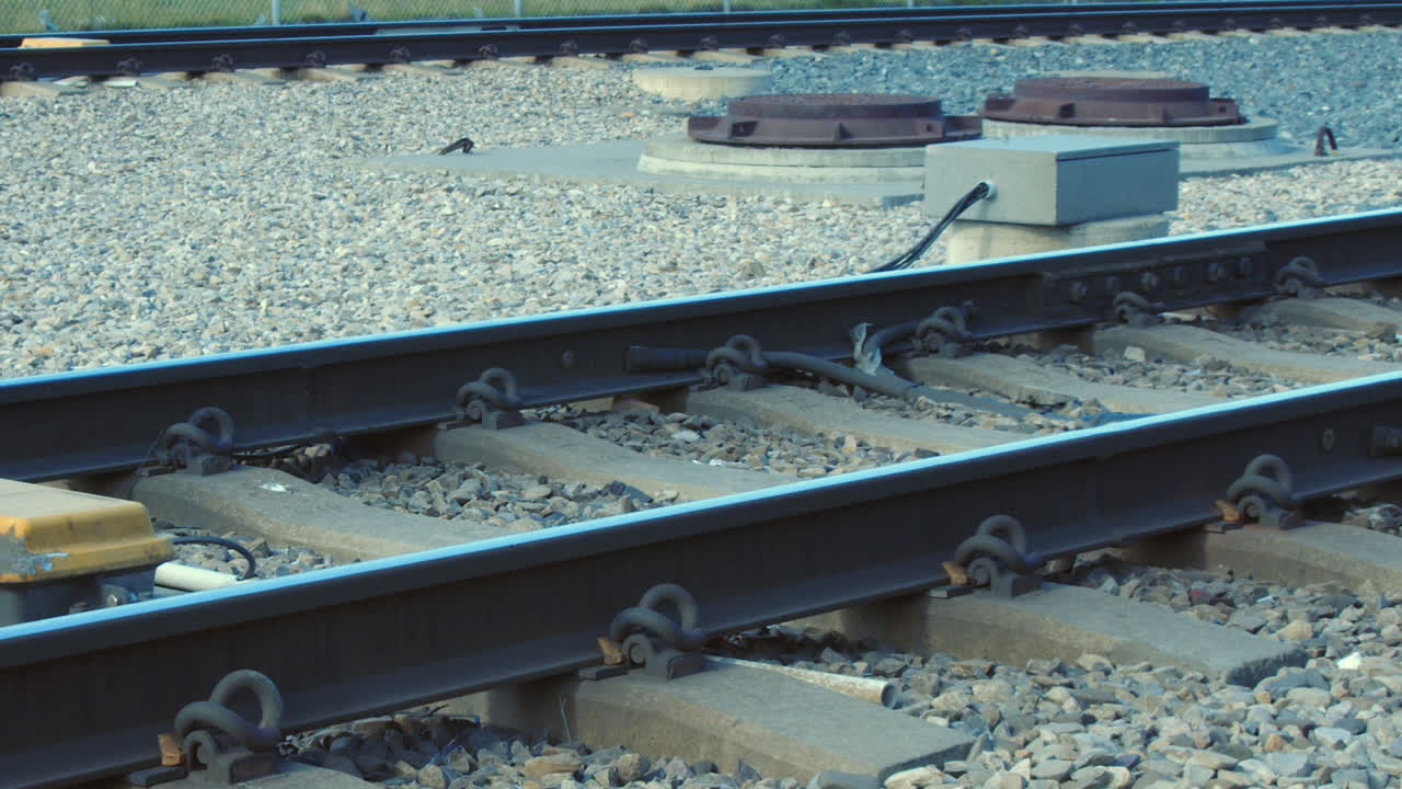 Railroad infrastructure: Commuter transit train passes on steel rails