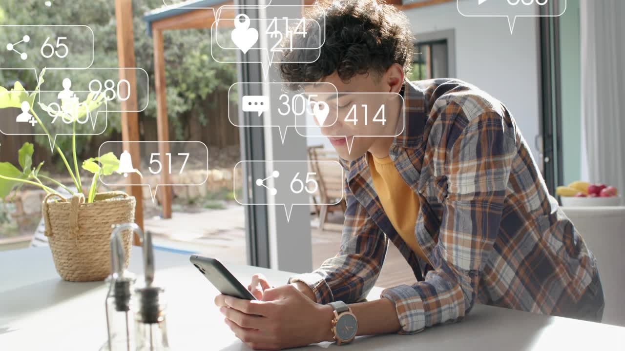 Man at kitchen counter, social notifications appearing around phone, scrolling, smiling for updates