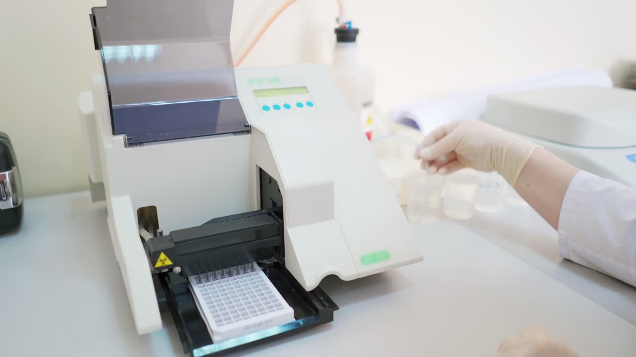 Medical device at work in lab. Automated machine for testing various samples in modern clinic. Laboratory equipment.