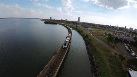 international train crossing paraná river bridge between argentina and paraguay