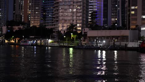 city lights reflecting on canal water