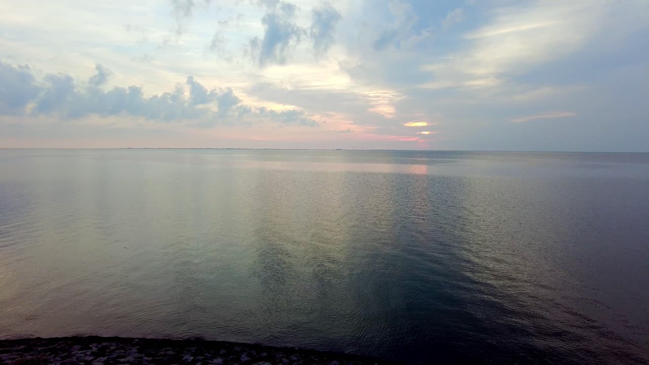 Sunset at Norderhafen (northern harbor) of the Nordstrand peninsula at the Wadden Sea National Park in Schleswig-Holstein, Germany, Europe