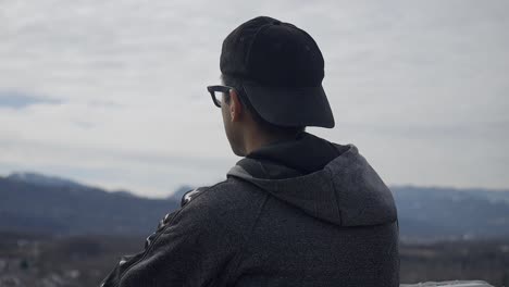 circular shot of young teenager starring at marvelous landscape