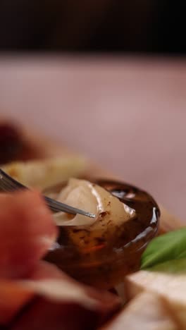 close-up of a cheese platter with cured meats and cheese