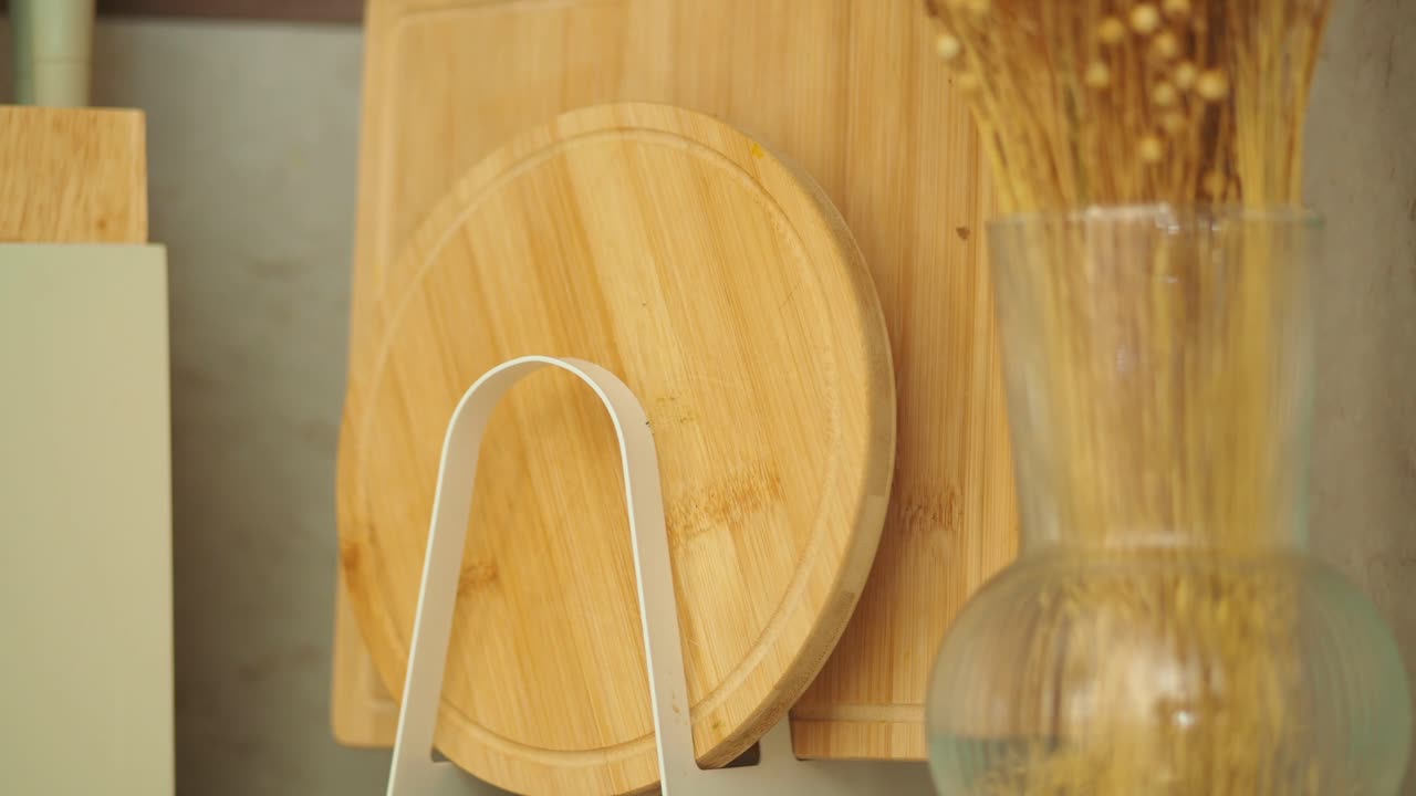 Kitchen scene with cutting boards and vase