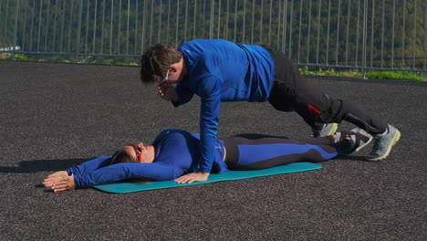 couple doing partner workout outdoor