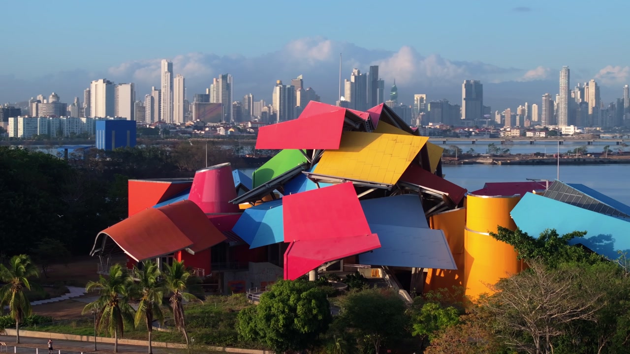 Aerial drone shot looking towards the Biomuseo on the Amador Causeway in Panama, with the shot moving down and to the left
