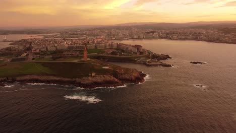 aerial footage la coruna cityscape view at sunset, drone fly above the city in galicia region north spain coastline over the atlantic sea, tourist spanish travel destination