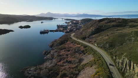 rise up revealing kyle of lochalsh with traffic and skye bridge in scottish highlands