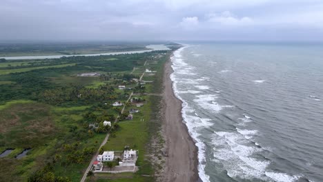 drone shot of coast line of veracruz in mexico with constructions